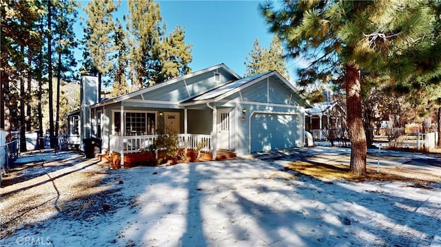 bungalow with a garage and covered porch