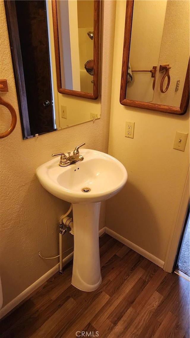 bathroom featuring sink and hardwood / wood-style flooring