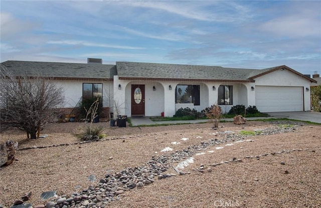 ranch-style home featuring a garage