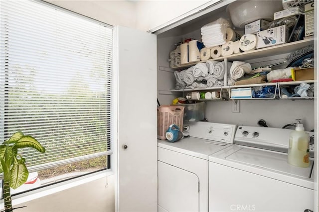 washroom featuring independent washer and dryer