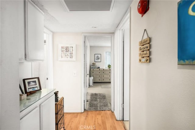 hallway with light wood-type flooring