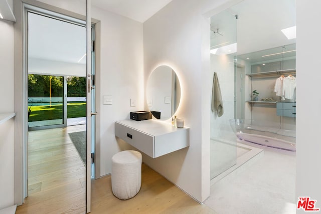 bathroom with wood-type flooring