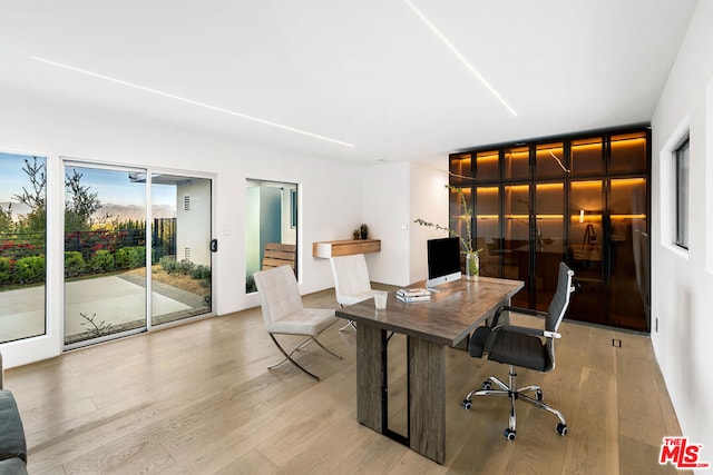 office area with light wood-type flooring