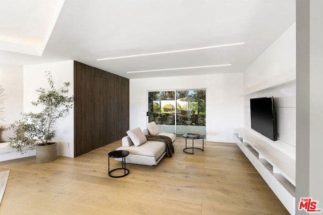 sitting room with light hardwood / wood-style floors