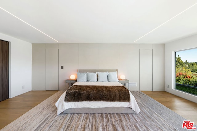 bedroom featuring light hardwood / wood-style floors