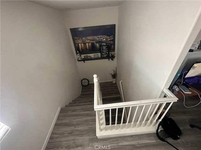 stairs with hardwood / wood-style flooring