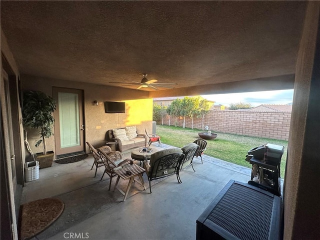 view of patio featuring an outdoor living space, ceiling fan, and area for grilling