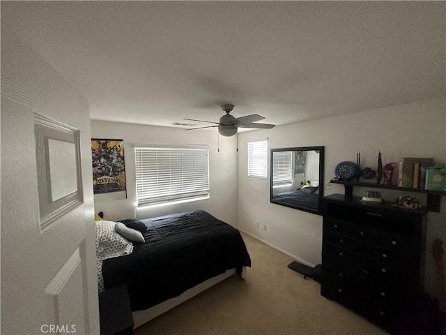 bedroom featuring ceiling fan and carpet floors