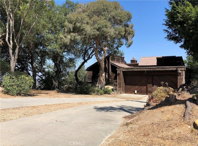 view of side of property with a garage