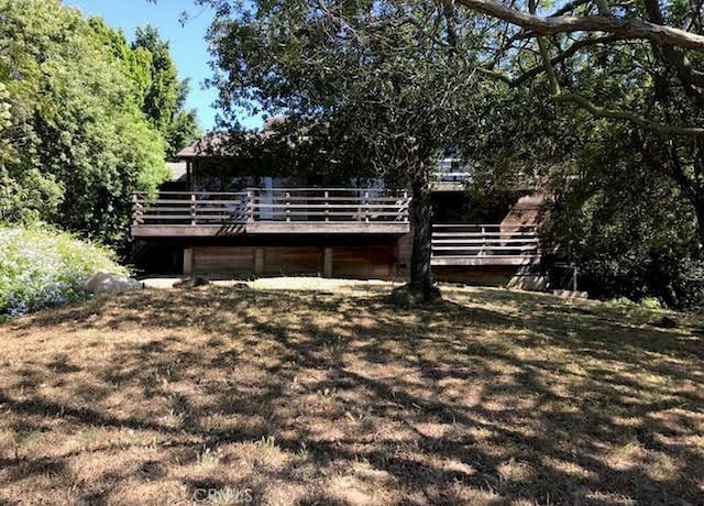 view of yard with a deck