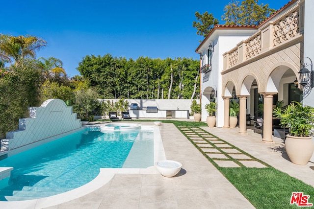 view of swimming pool featuring a patio area