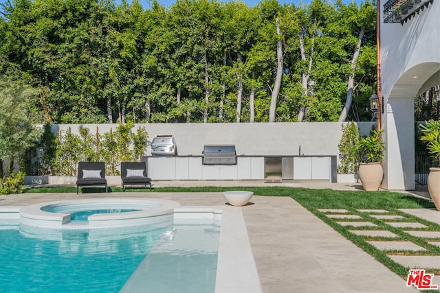 view of swimming pool featuring a patio, an in ground hot tub, and grilling area