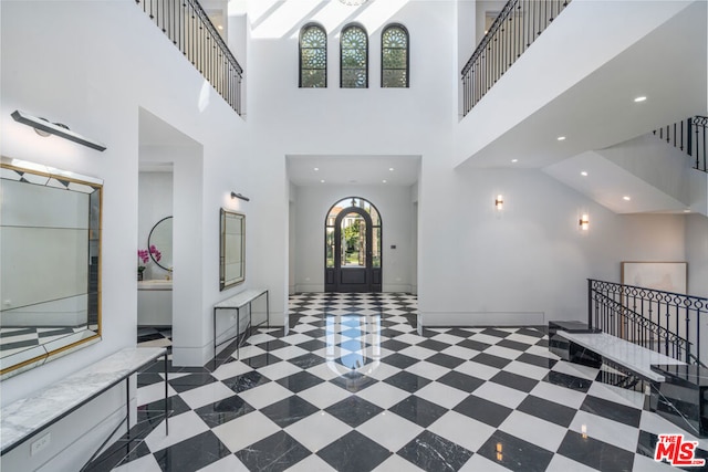 entryway with a high ceiling