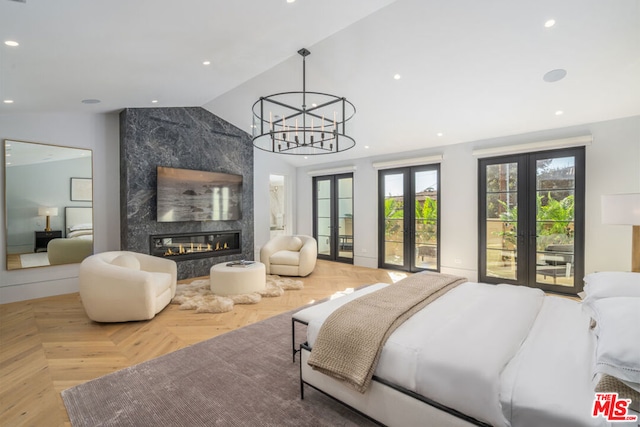 bedroom featuring a premium fireplace, access to exterior, vaulted ceiling, parquet floors, and french doors