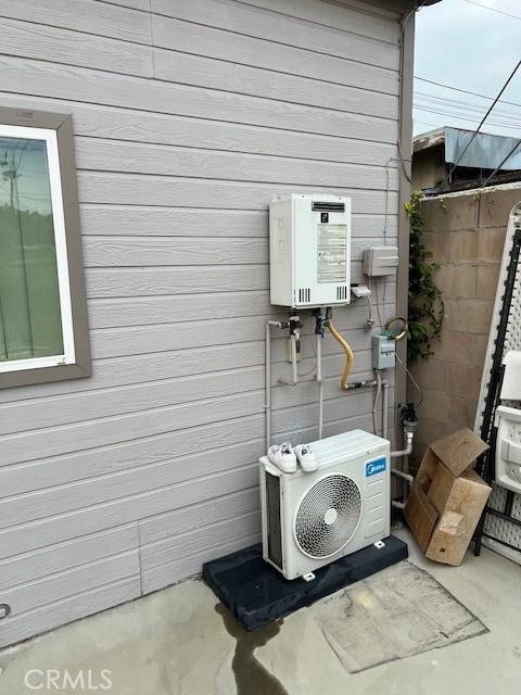 exterior space featuring ac unit and water heater