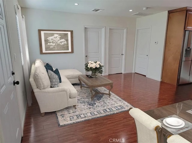 living room with dark hardwood / wood-style floors