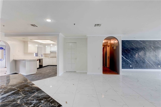 unfurnished living room featuring ornamental molding