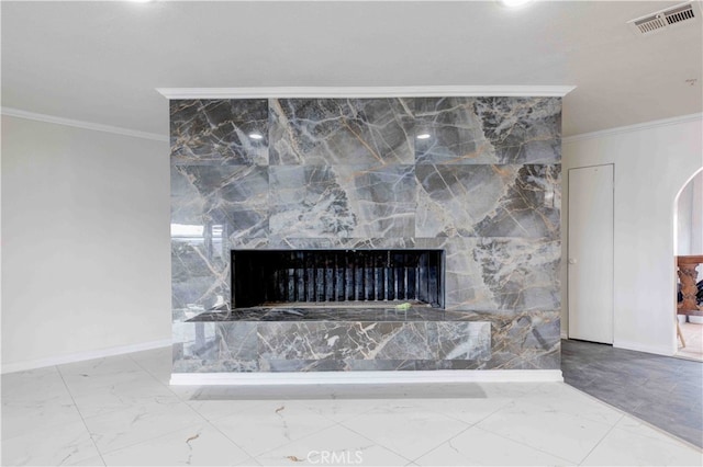 room details featuring ornamental molding and a fireplace