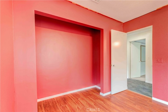 interior space with hardwood / wood-style flooring