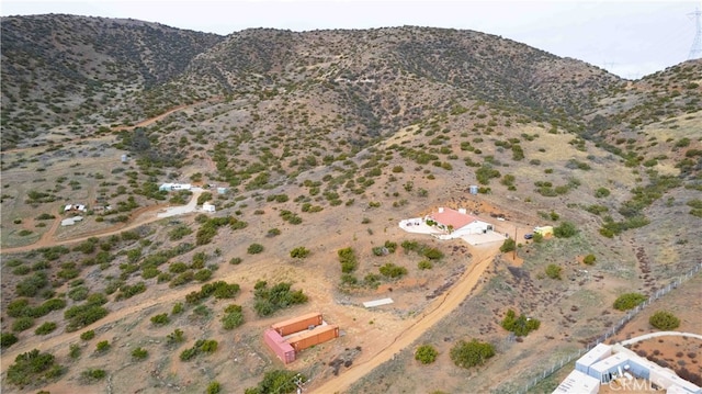 birds eye view of property featuring a mountain view