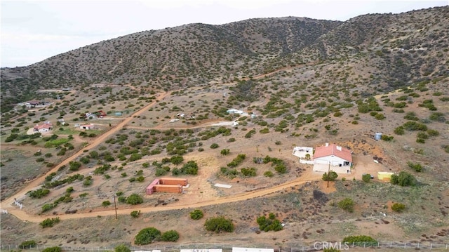 birds eye view of property featuring a mountain view