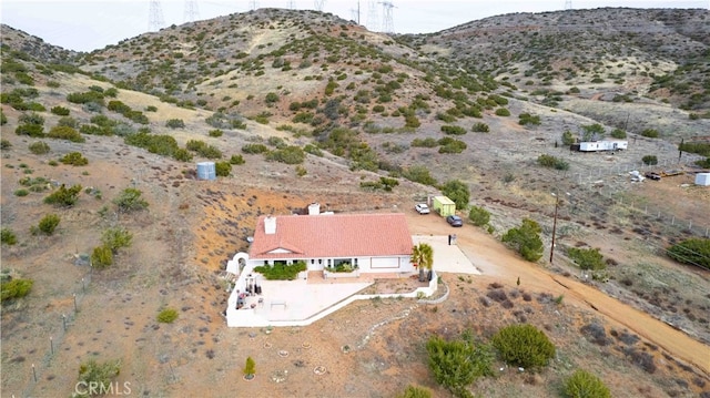 birds eye view of property featuring a mountain view