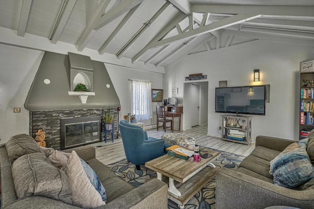 living room with beam ceiling, wood-type flooring, a fireplace, and high vaulted ceiling