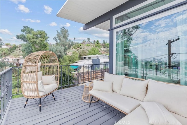 wooden deck with an outdoor hangout area