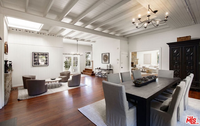 dining room with beamed ceiling, dark hardwood / wood-style floors, and a notable chandelier