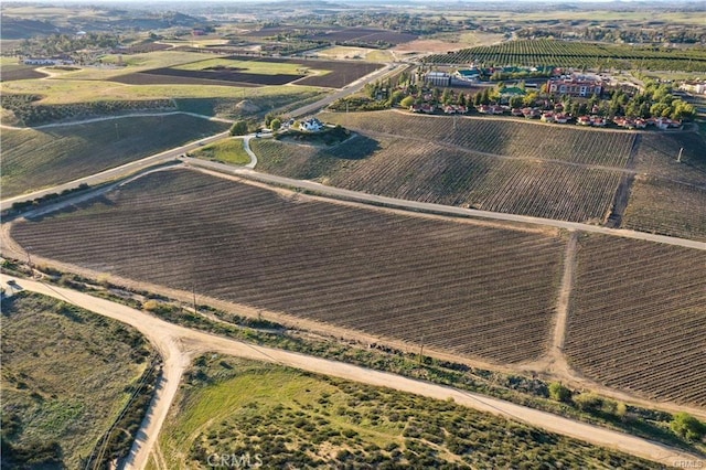 birds eye view of property with a rural view