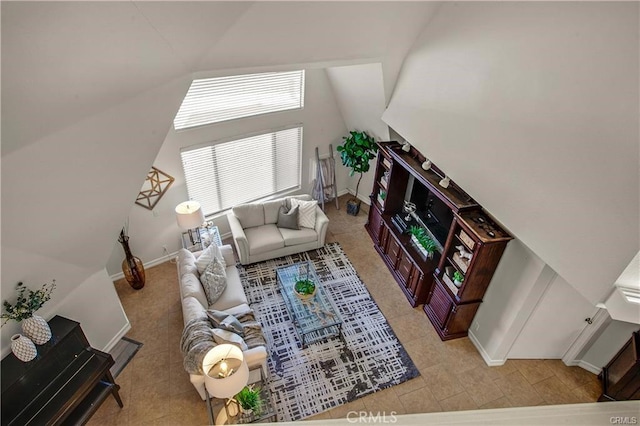 living room featuring vaulted ceiling