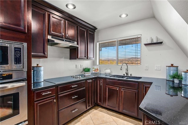 kitchen featuring sink, vaulted ceiling, light tile patterned floors, and appliances with stainless steel finishes