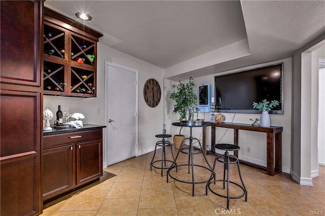 tiled dining space with indoor bar