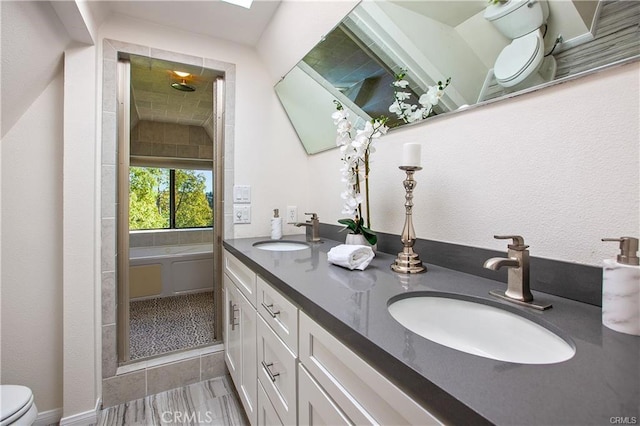 bathroom featuring tile patterned floors, toilet, and vanity