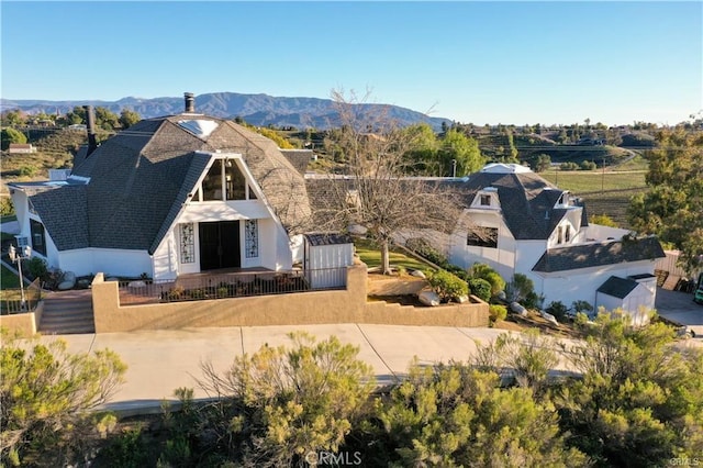 view of front of home featuring a mountain view