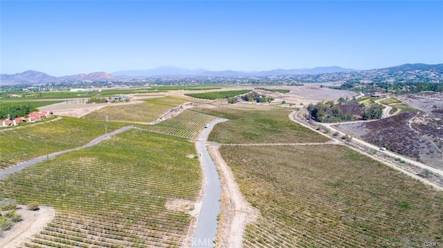 drone / aerial view featuring a mountain view and a rural view