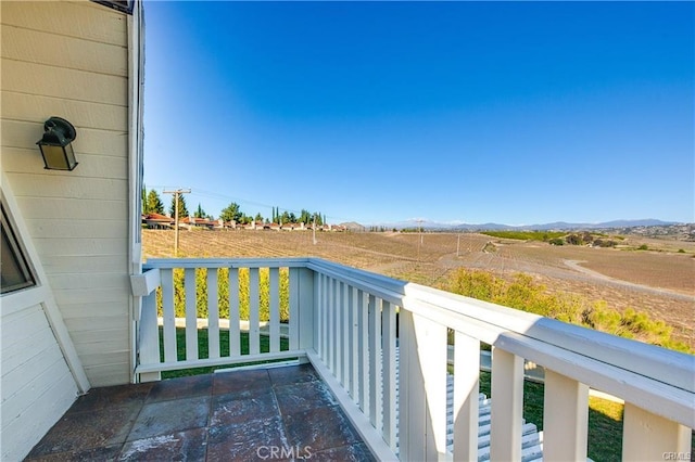 balcony featuring a rural view