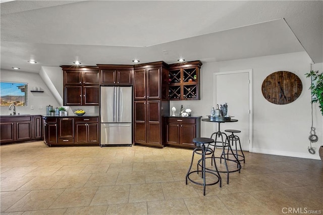 kitchen with sink and stainless steel fridge