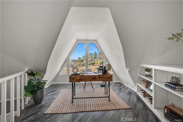 office space featuring dark wood-type flooring and vaulted ceiling