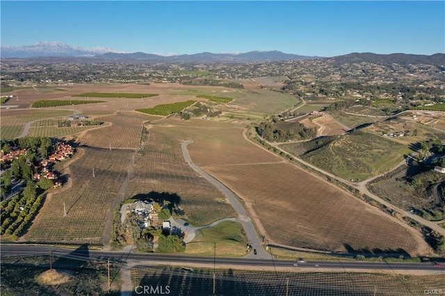 drone / aerial view with a mountain view and a rural view