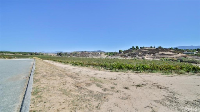 view of road with a mountain view and a rural view