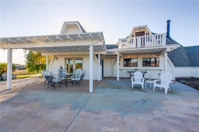 back of property with french doors and a patio area