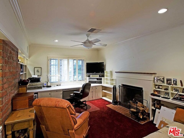 office featuring ceiling fan, brick wall, a fireplace, and dark colored carpet