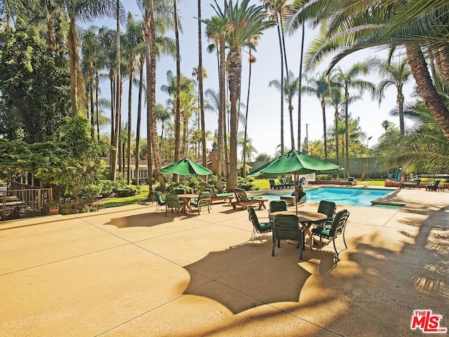 view of patio / terrace featuring a fenced in pool