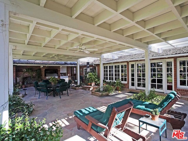 view of patio / terrace with french doors, an outdoor living space, and ceiling fan