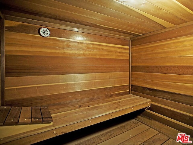 view of sauna with wooden walls