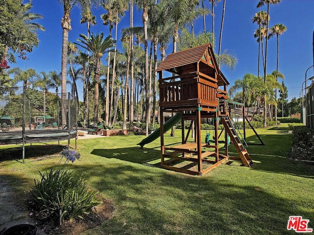 view of jungle gym featuring a trampoline and a yard