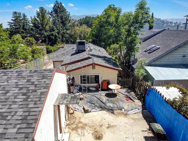 6843 Beckett St, Tujunga, CA 91042 - exterior view of roof with shingles and a fenced backyard