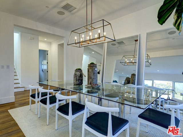 kitchen featuring decorative light fixtures, dark hardwood / wood-style floors, and stone countertops