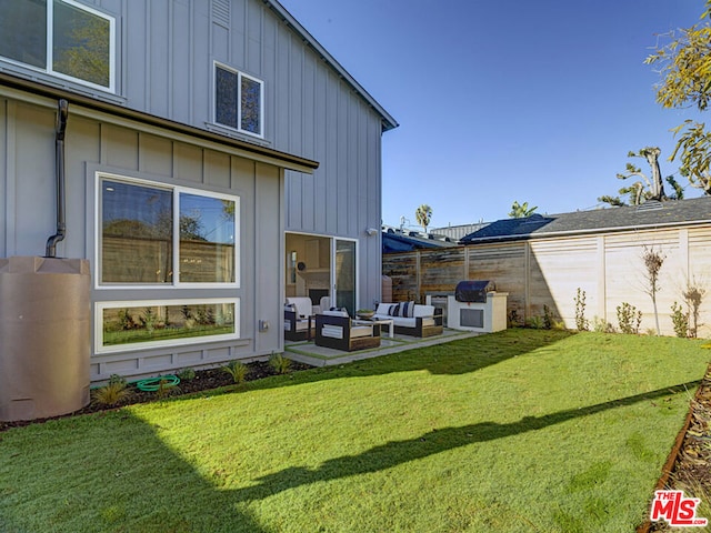 view of yard with an outdoor living space and a patio area